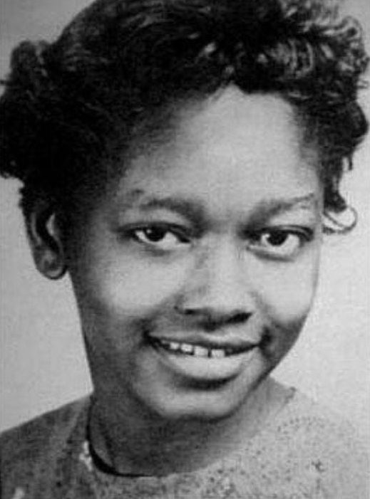 A young girl smiling