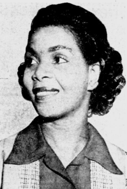 A woman facing left and smiling