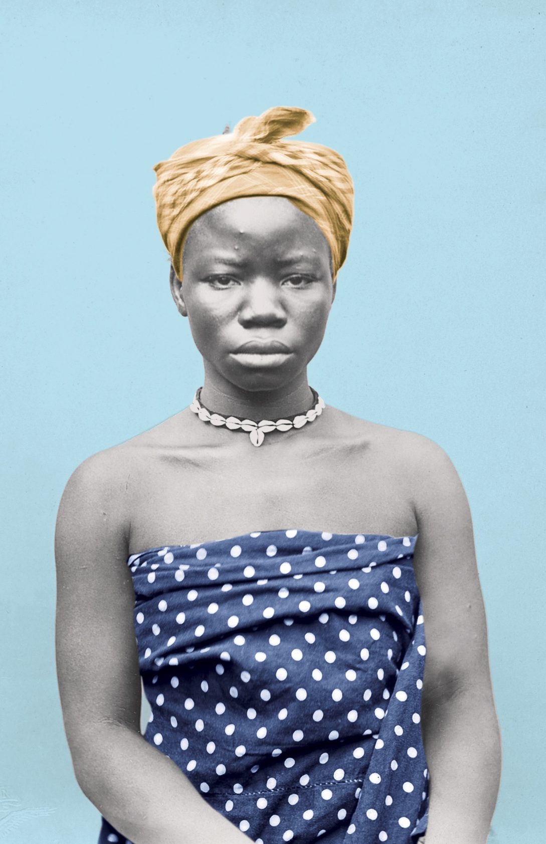 A woman in headwrap and dress seated and facing forward